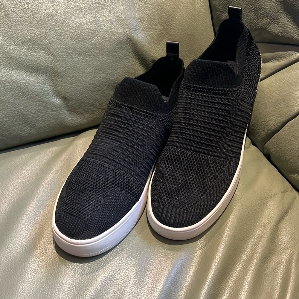 Steve Madden black mesh slip on shoes.